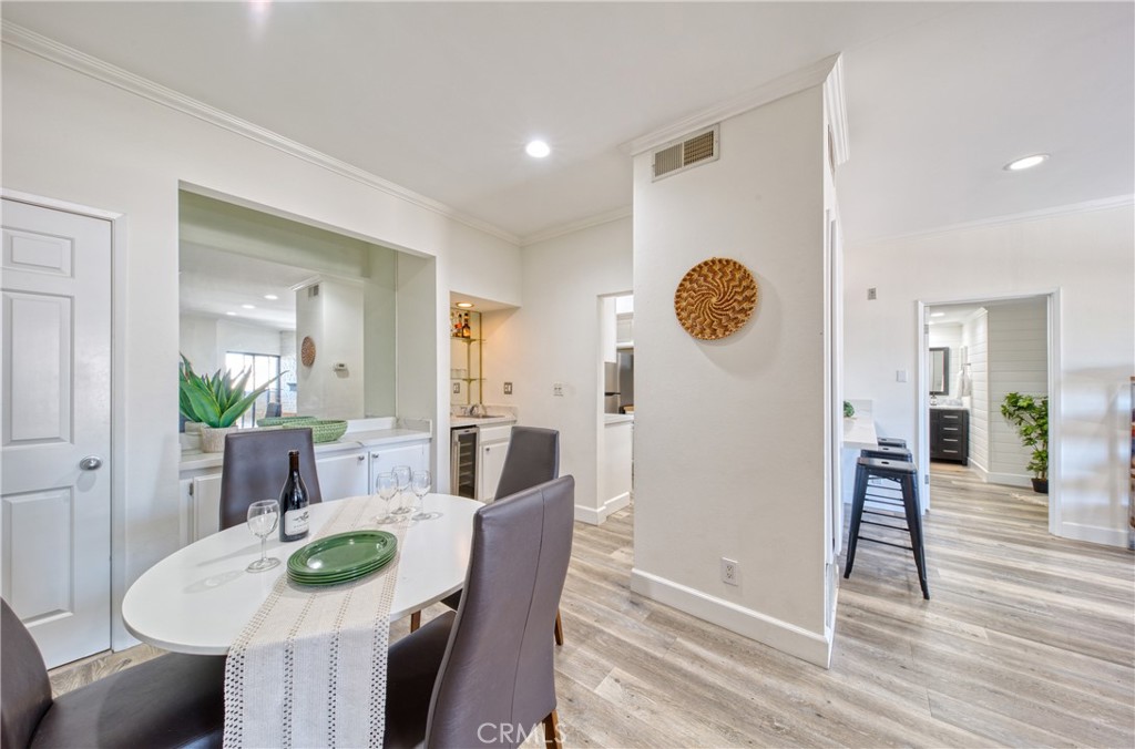 1665 Federal Avenue, Unit 302 Los Angeles, CA 90025 - Photo 9 of 31 a view of a dining room with furniture and wooden floor