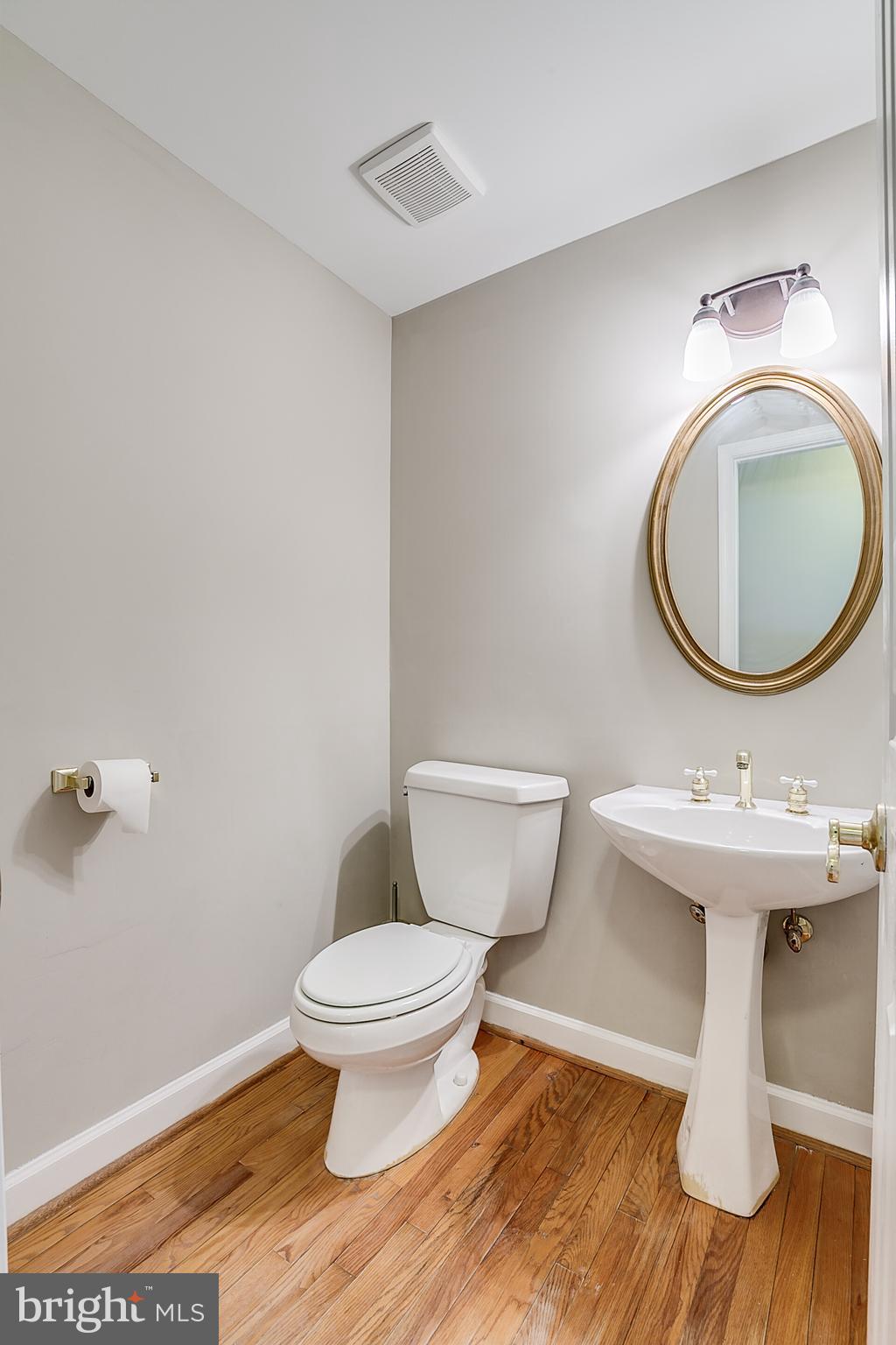 2391 Bear Den Road Frederick, MD 21701 - Photo 22 of 42 Half Bathroom with hardwood floors