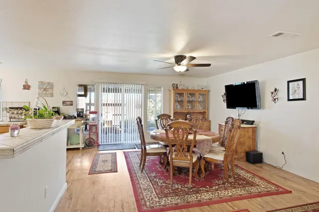a view of a dining room with furniture window and wooden floor
