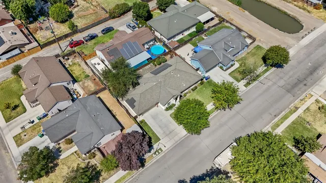 an aerial view of residential house with outdoor space