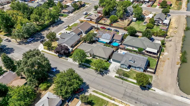 an aerial view of residential houses with outdoor space