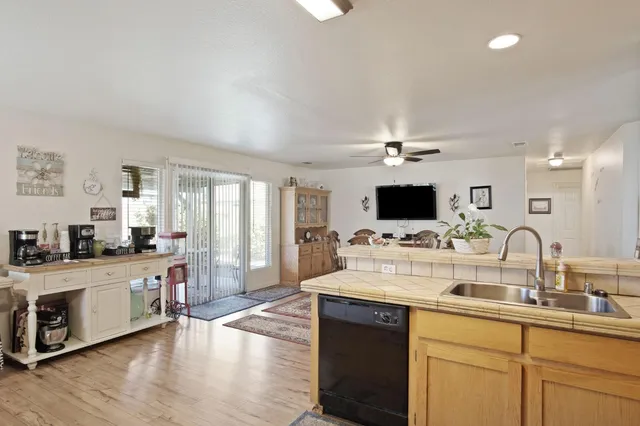 a kitchen with a sink and a stove top oven