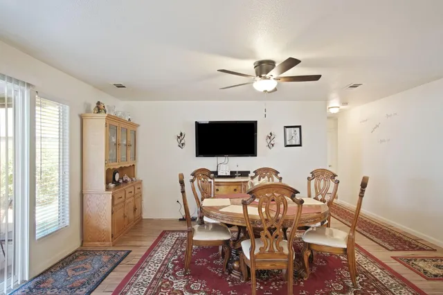a view of a livingroom with furniture and a flat screen tv