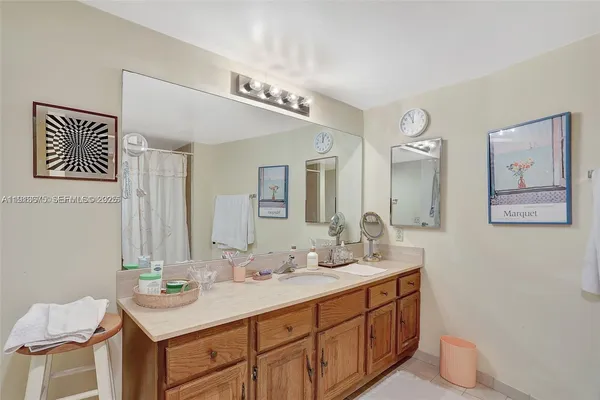 a bathroom with a double vanity sink and a mirror