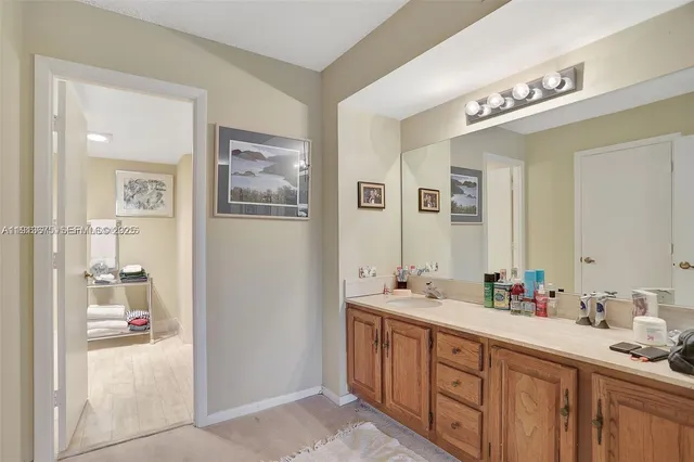 a bathroom with a shower a toilet and a sink