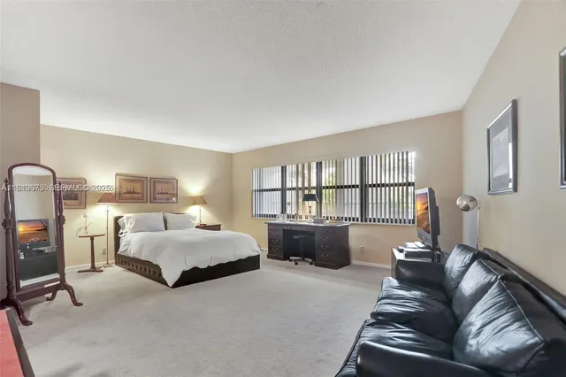 a bedroom with a bed and a view of bedroom