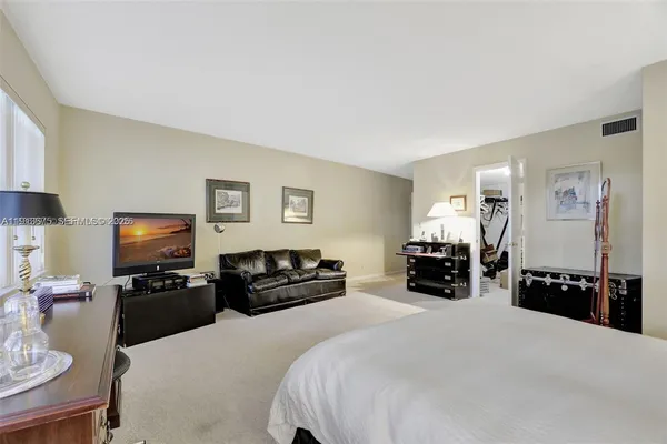 a living room with furniture fireplace and a window