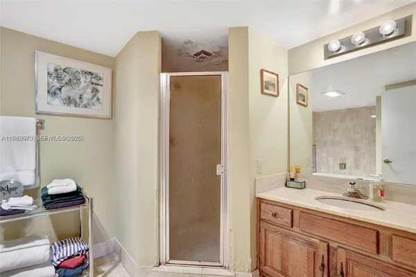a bathroom with a tub sink and toilet