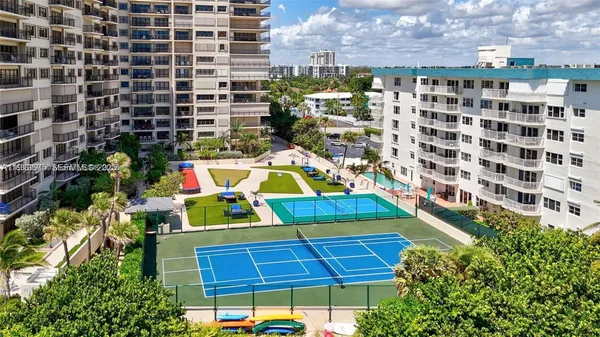 a view of outdoor space with swimming pool and outdoor seating