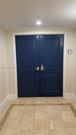 a living room with furniture large window and a table