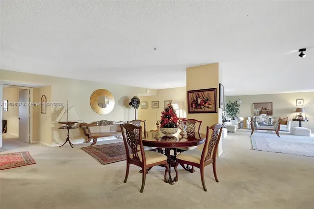 a view of a kitchen with a sink and a fireplace