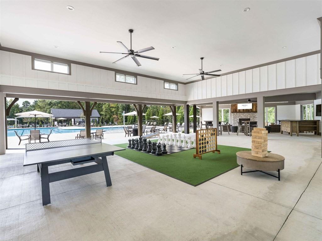 133 Pyramid Lane, Unit THC1 Hoschton, GA 30548 - Photo 15 of 20 a living room with patio furniture and a floor to ceiling window