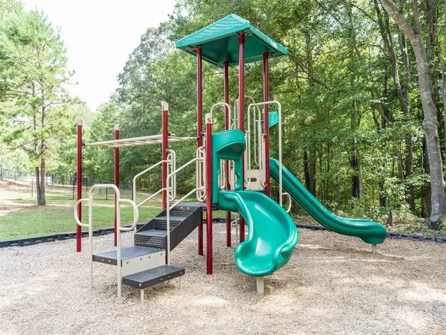 a view of a park with a slide
