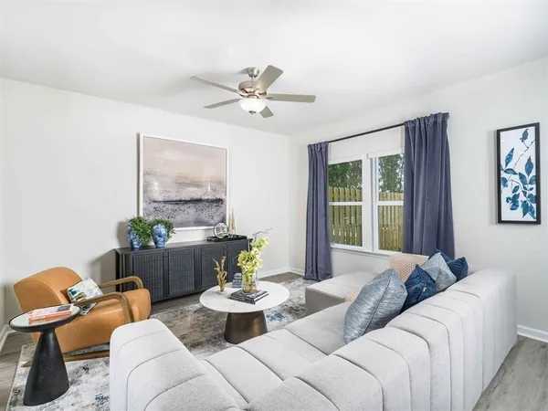 a living room with furniture and window