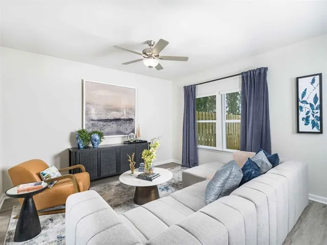 a living room with furniture and window