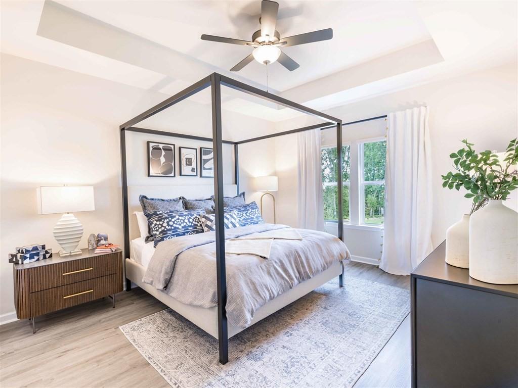 133 Pyramid Lane, Unit THC1 Hoschton, GA 30548 - Photo 7 of 20 a bedroom with a bed chandelier and a window