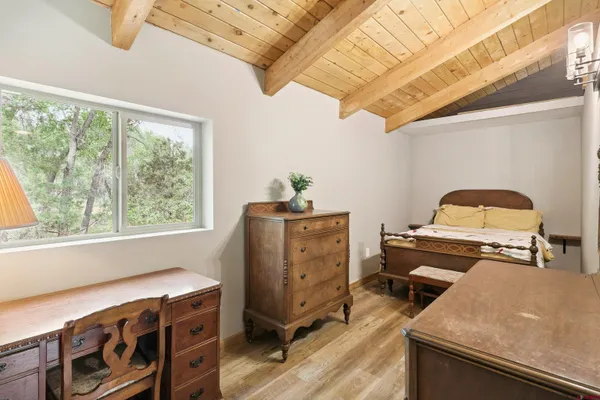 a bedroom with a bed and a dresser