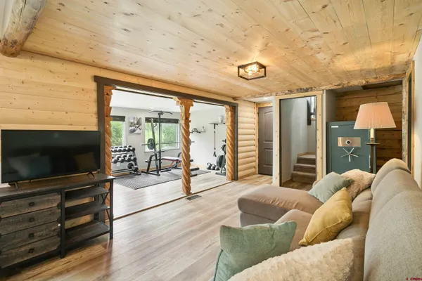 a living room with furniture and a flat screen tv
