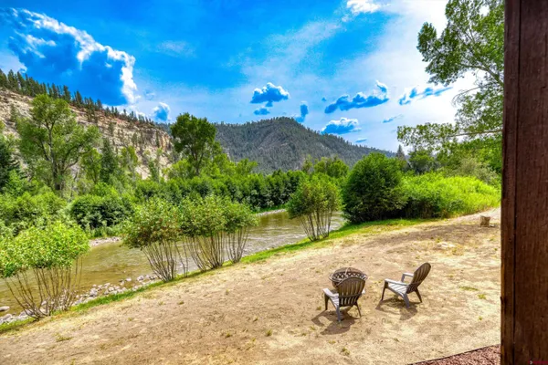 a view of a lake with a yard