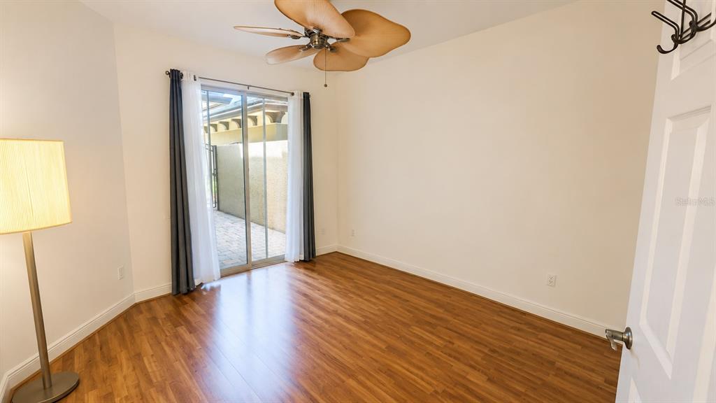 6552 Moorings Point Circle, Unit 102 Lakewood Ranch, FL 34202 - Photo 26 of 57 a view of empty room with wooden floor