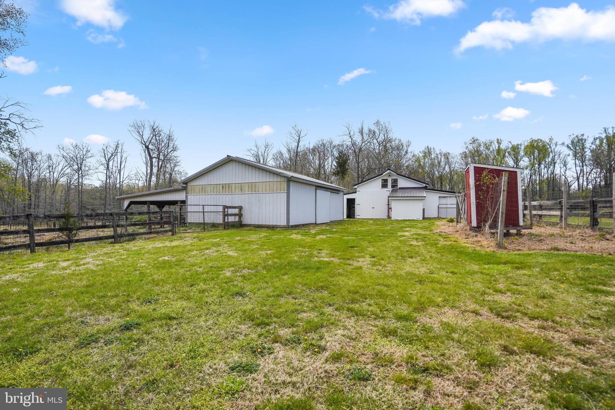 15775 Mt Calvert Road Upper Marlboro, MD 20772 - Photo 38 of 58 Tractor shed, barn, red chicken coop
