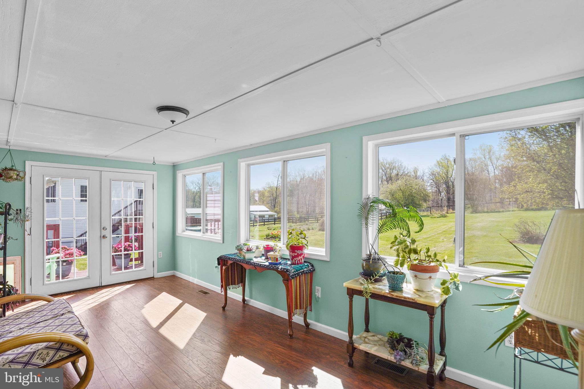 15775 Mt Calvert Road Upper Marlboro, MD 20772 - Photo 8 of 58 Sunroom looks out on the pastures