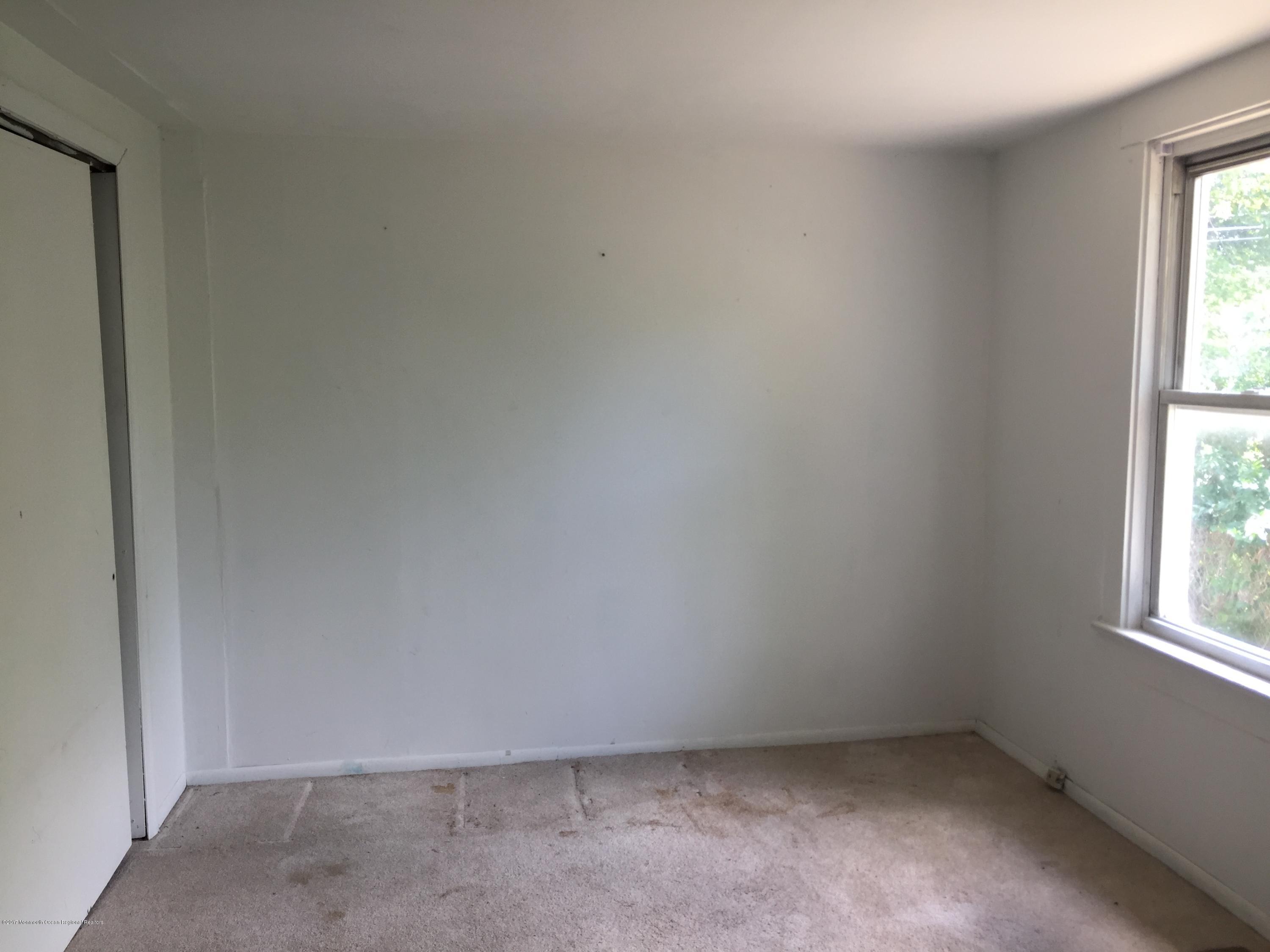 99 Main Street Toms River, NJ 08757 - Photo 8 of 17 an empty room with a window