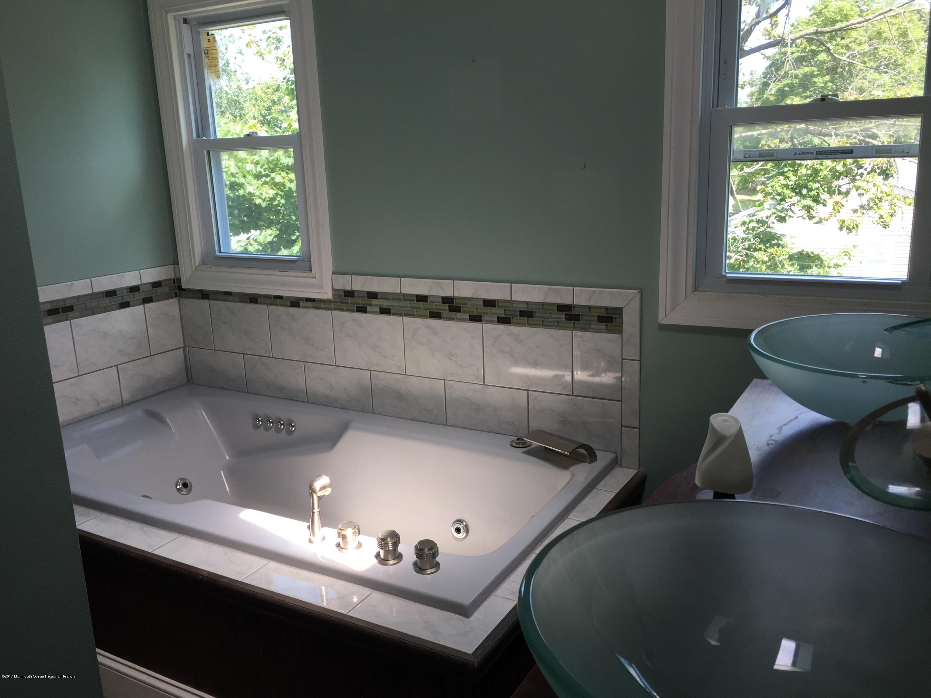 99 Main Street Toms River, NJ 08757 - Photo 9 of 17 a bathroom with a sink and a window