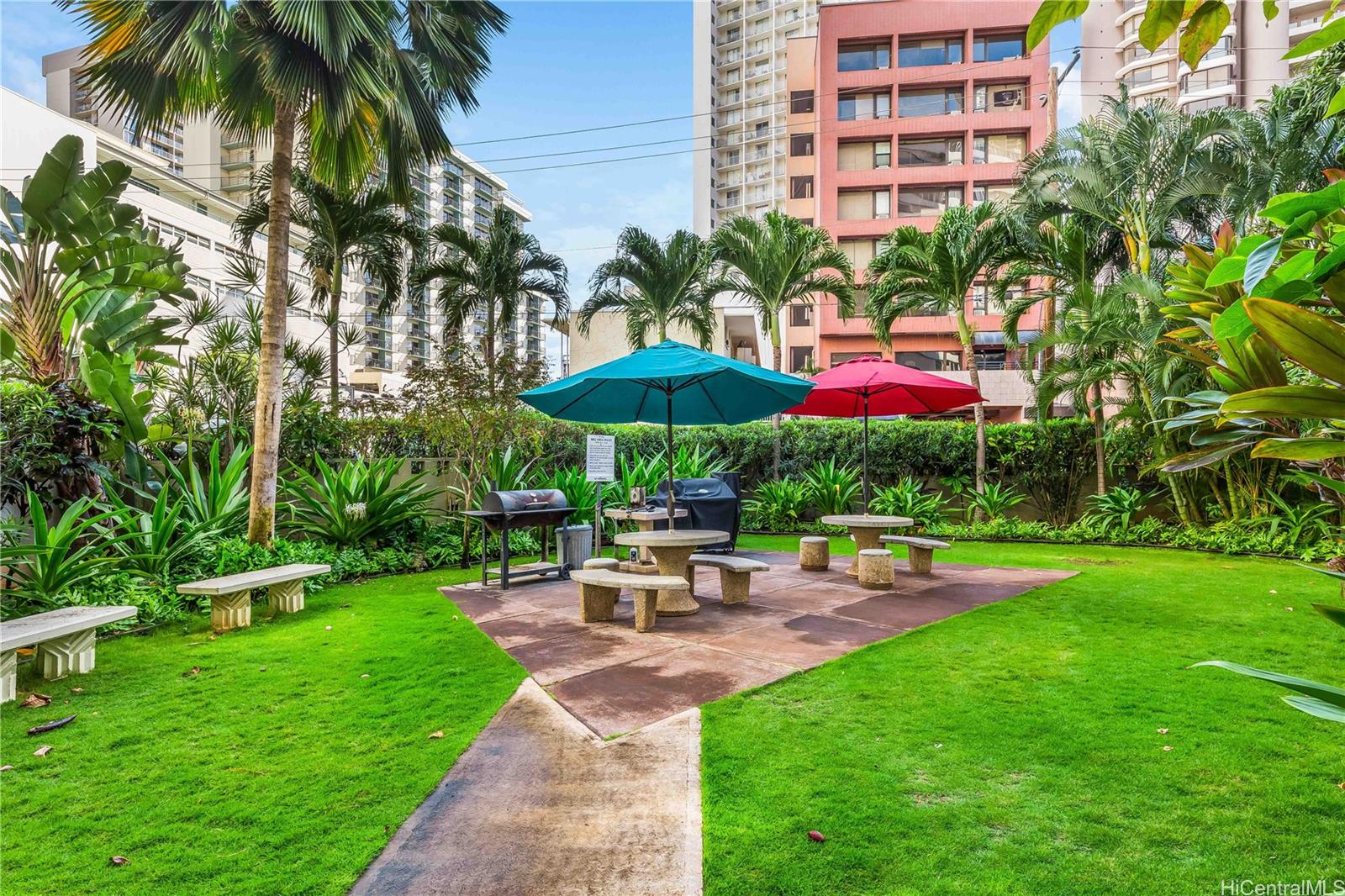 425 Ena Road, Unit 706B Honolulu, HI 96815 - Photo 22 of 23 a view of a swimming pool with a table and chairs