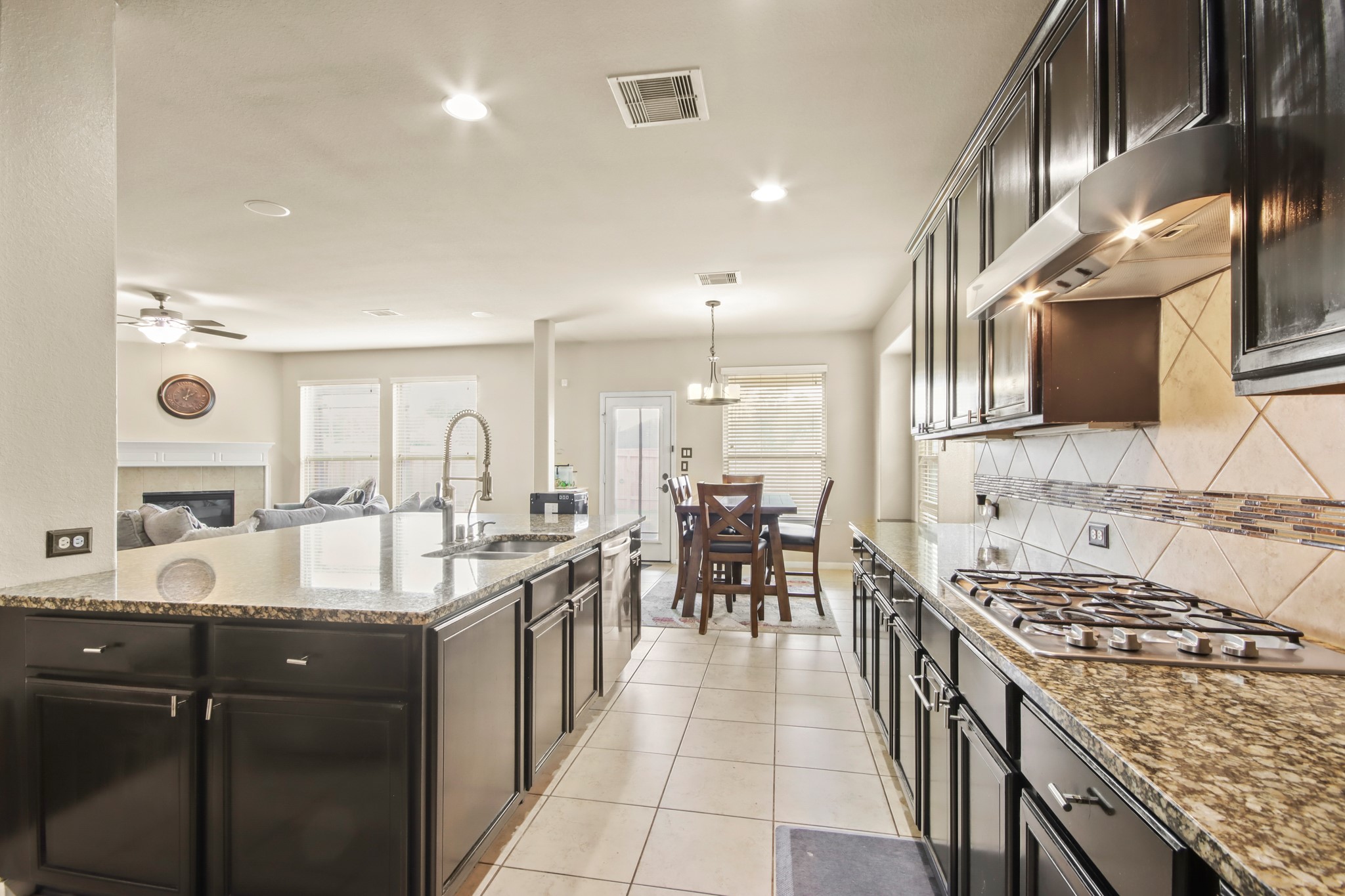 25407 Terrain Park Drive Spring, TX 77373 - Photo 15 of 33 Open kitchen design overlooking the main living areas, perfect for entertaining and staying connected.