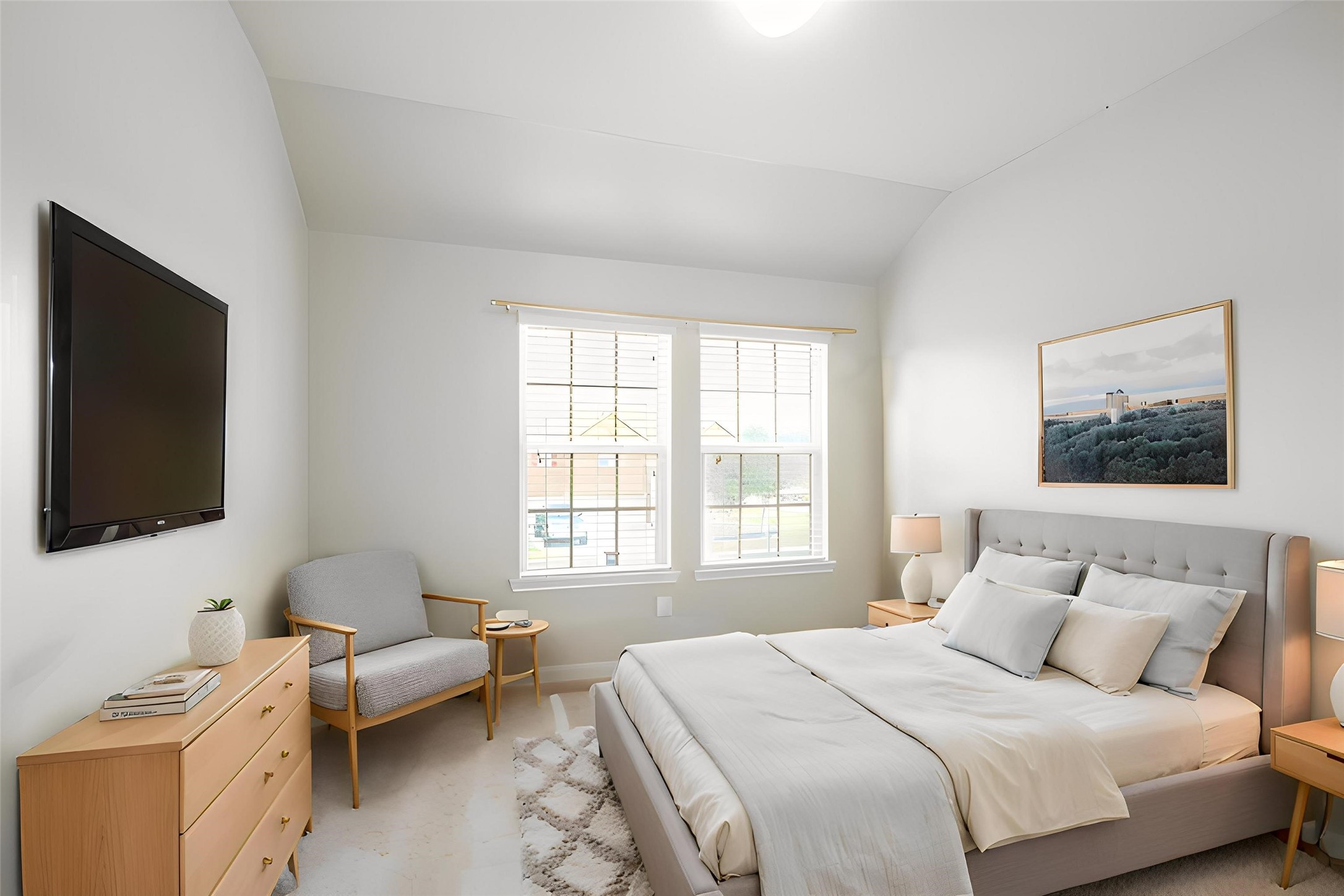25407 Terrain Park Drive Spring, TX 77373 - Photo 24 of 33 Virtually Staged: Bright and airy bedroom featuring vaulted ceilings and a clean, modern design. Two large windows allow abundant natural light to fill the space, creating a warm and welcoming atmosphere.