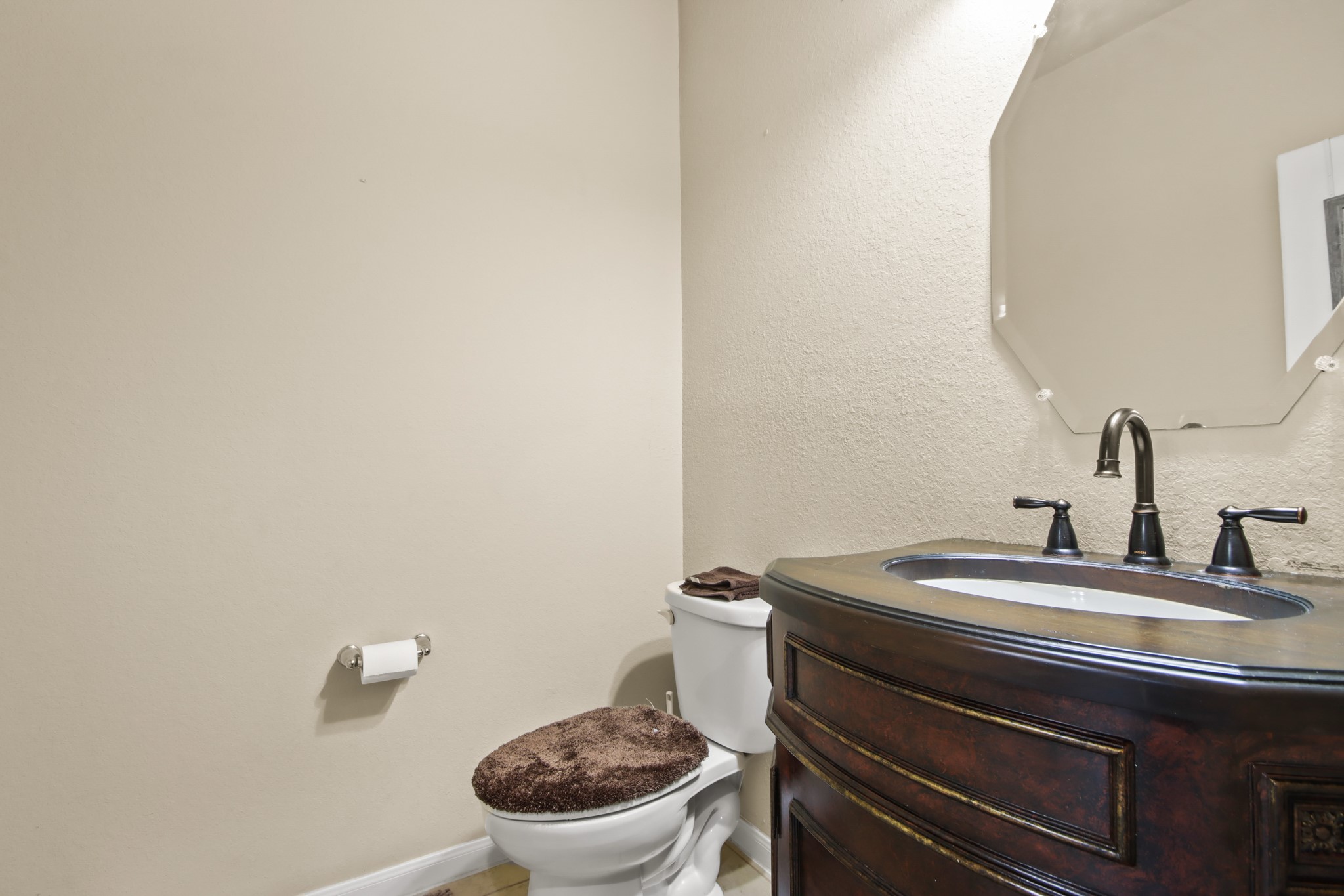 25407 Terrain Park Drive Spring, TX 77373 - Photo 9 of 33 Stylish powder room with a modern vanity and clean finishes.