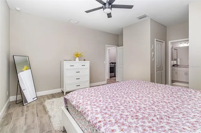 a bedroom with a bed and a dresser