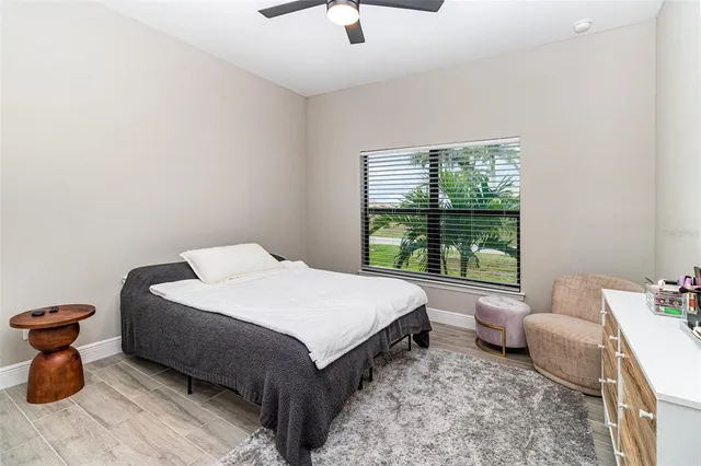 a spacious bedroom with a bed and a window