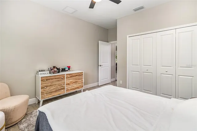 a bedroom with a bed and a dresser