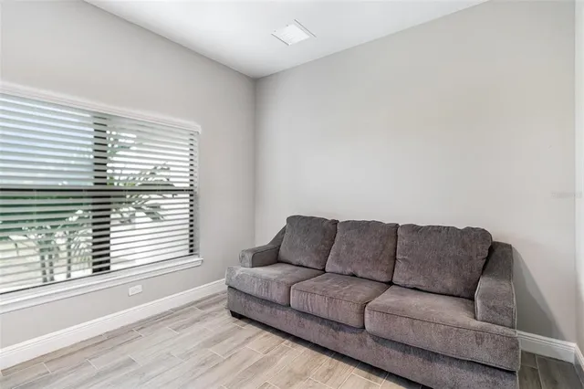 a living room with furniture and a window
