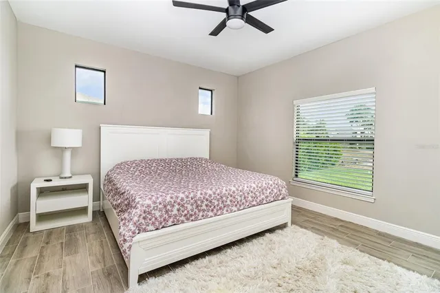 a bedroom with a bed and window