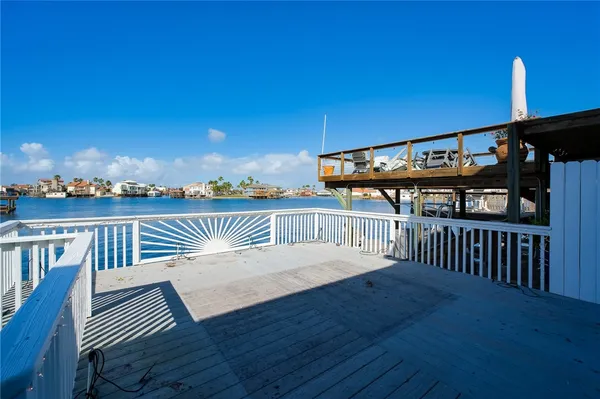 a view of a roof deck with wooden floor