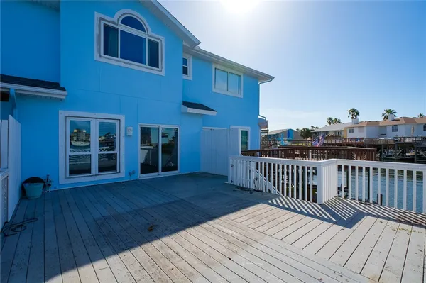 a view of a house with wooden deck