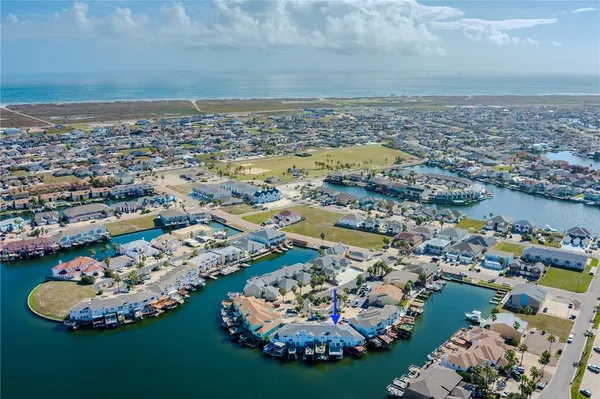 an aerial view of a residential houses with outdoor space
