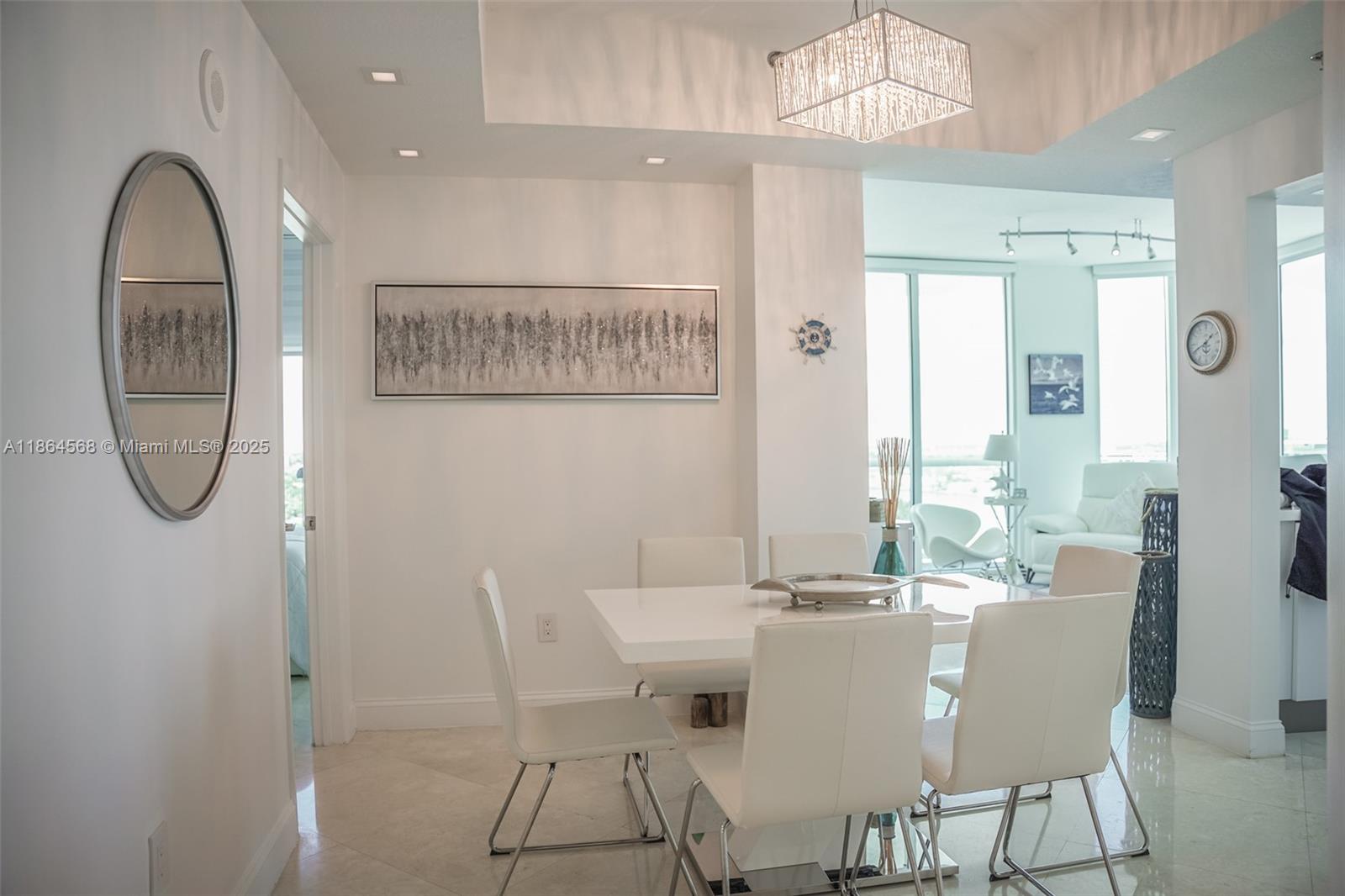 6515 Collins Avenue, Unit 1709 Miami Beach, FL 33141 - Photo 11 of 30 a dining room with furniture and window