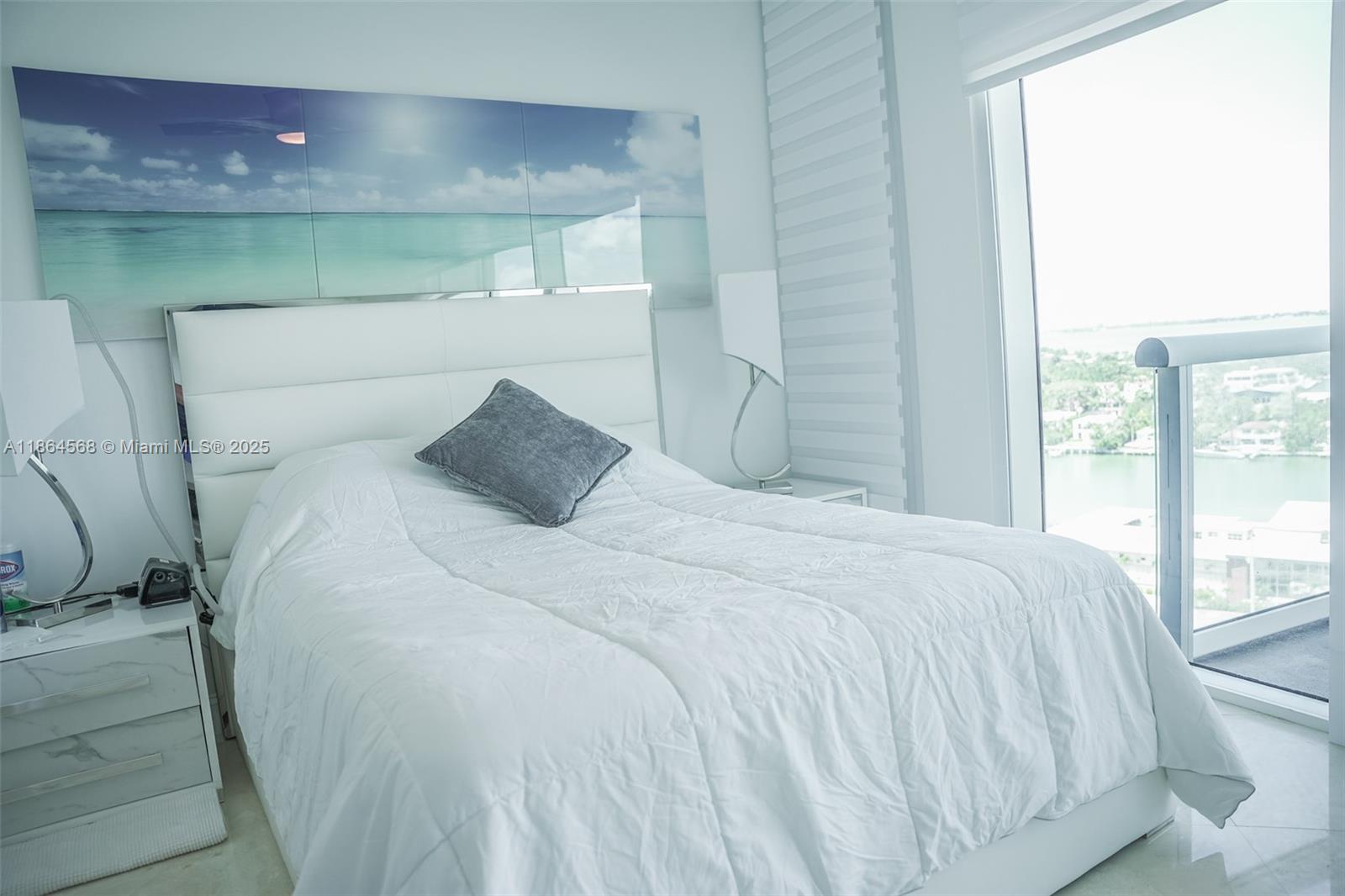 6515 Collins Avenue, Unit 1709 Miami Beach, FL 33141 - Photo 13 of 30 a bedroom with a bed and a window