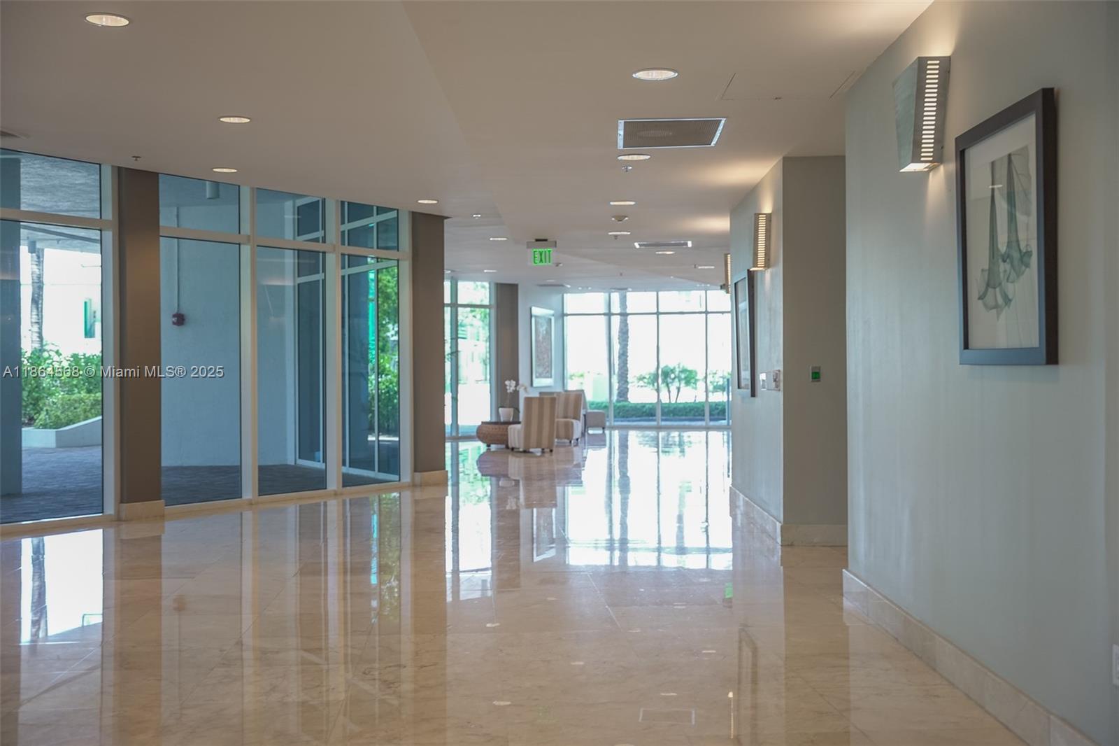6515 Collins Avenue, Unit 1709 Miami Beach, FL 33141 - Photo 18 of 30 a view of front door with glass door and dining room