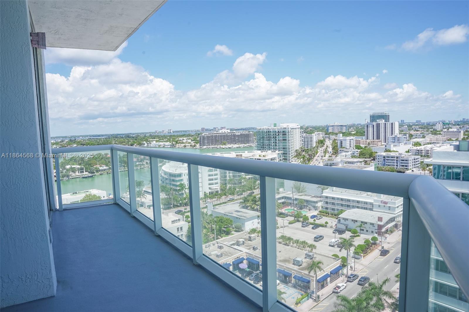 6515 Collins Avenue, Unit 1709 Miami Beach, FL 33141 - Photo 2 of 30 a view of a city from a balcony