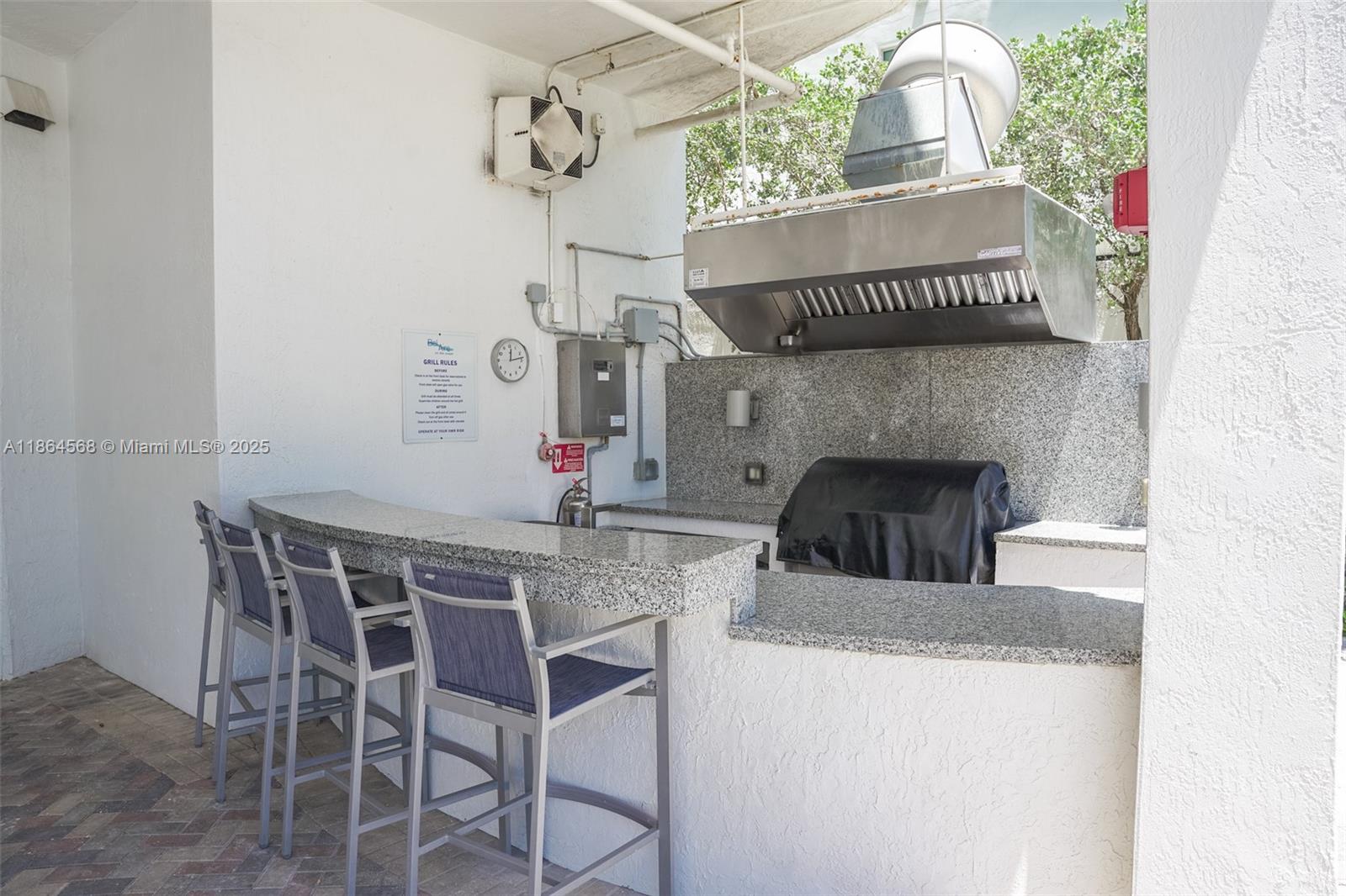 6515 Collins Avenue, Unit 1709 Miami Beach, FL 33141 - Photo 21 of 30 a view of a dining room with furniture and chandelier