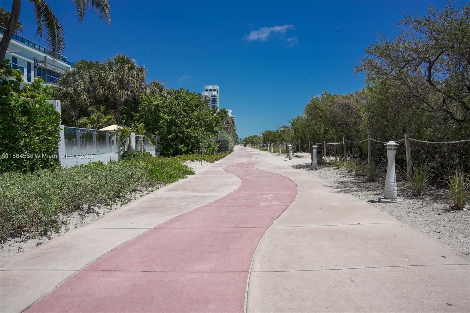 6515 Collins Avenue, Unit 1709 Miami Beach, FL 33141 - Photo 24 of 30 a view of a backyard with plants and a patio