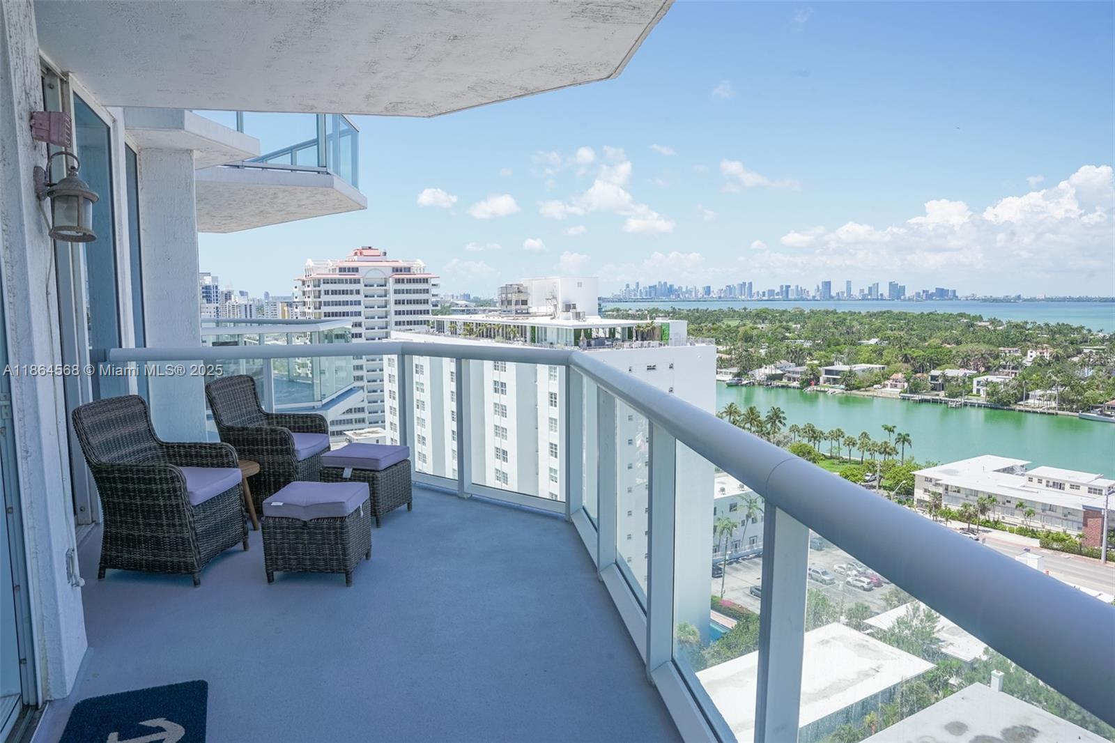 6515 Collins Avenue, Unit 1709 Miami Beach, FL 33141 - Photo 3 of 30 a view of a balcony with outdoor seating and city view