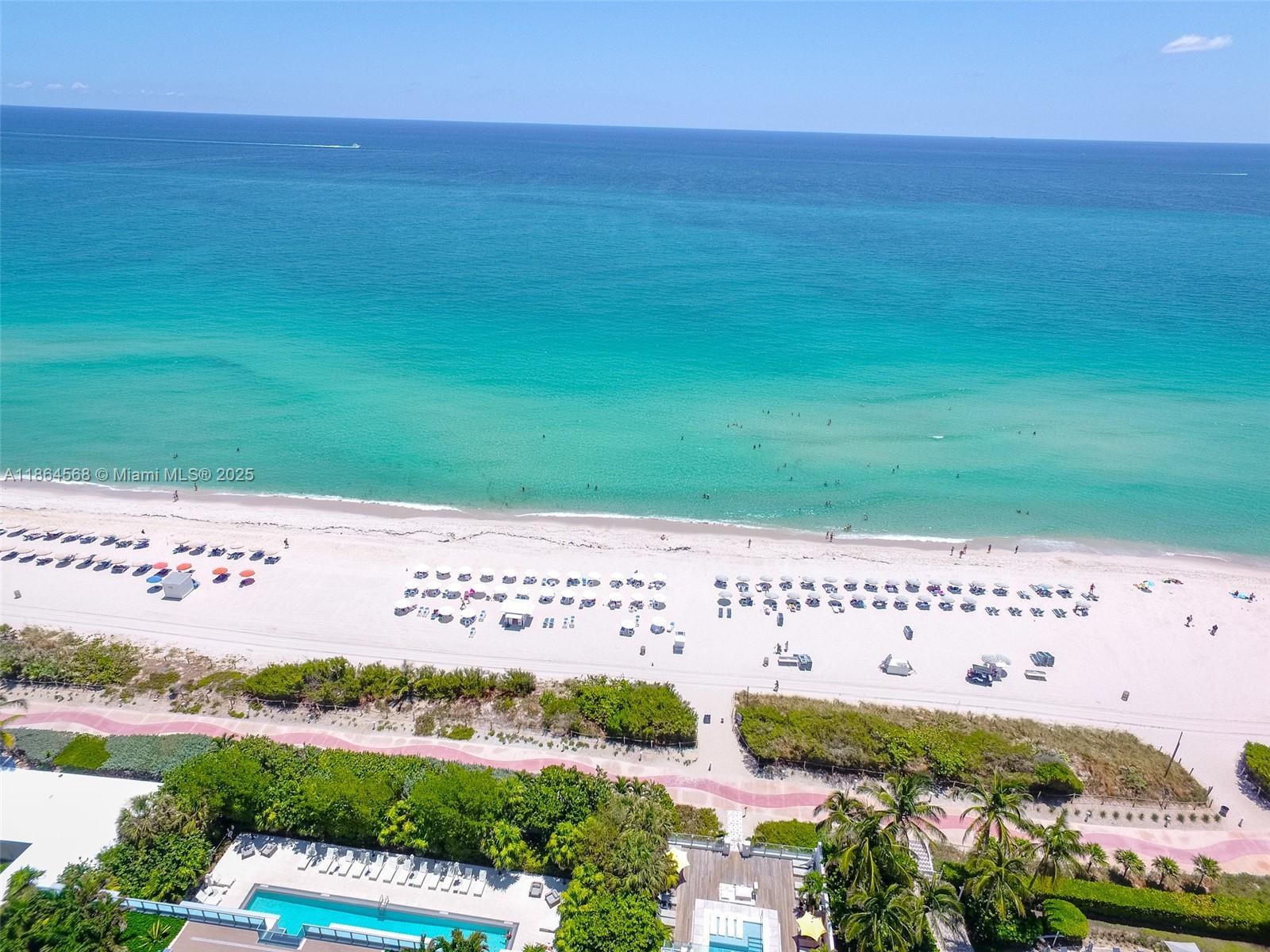 6515 Collins Avenue, Unit 1709 Miami Beach, FL 33141 - Photo 6 of 30 a view of a big yard with an ocean view