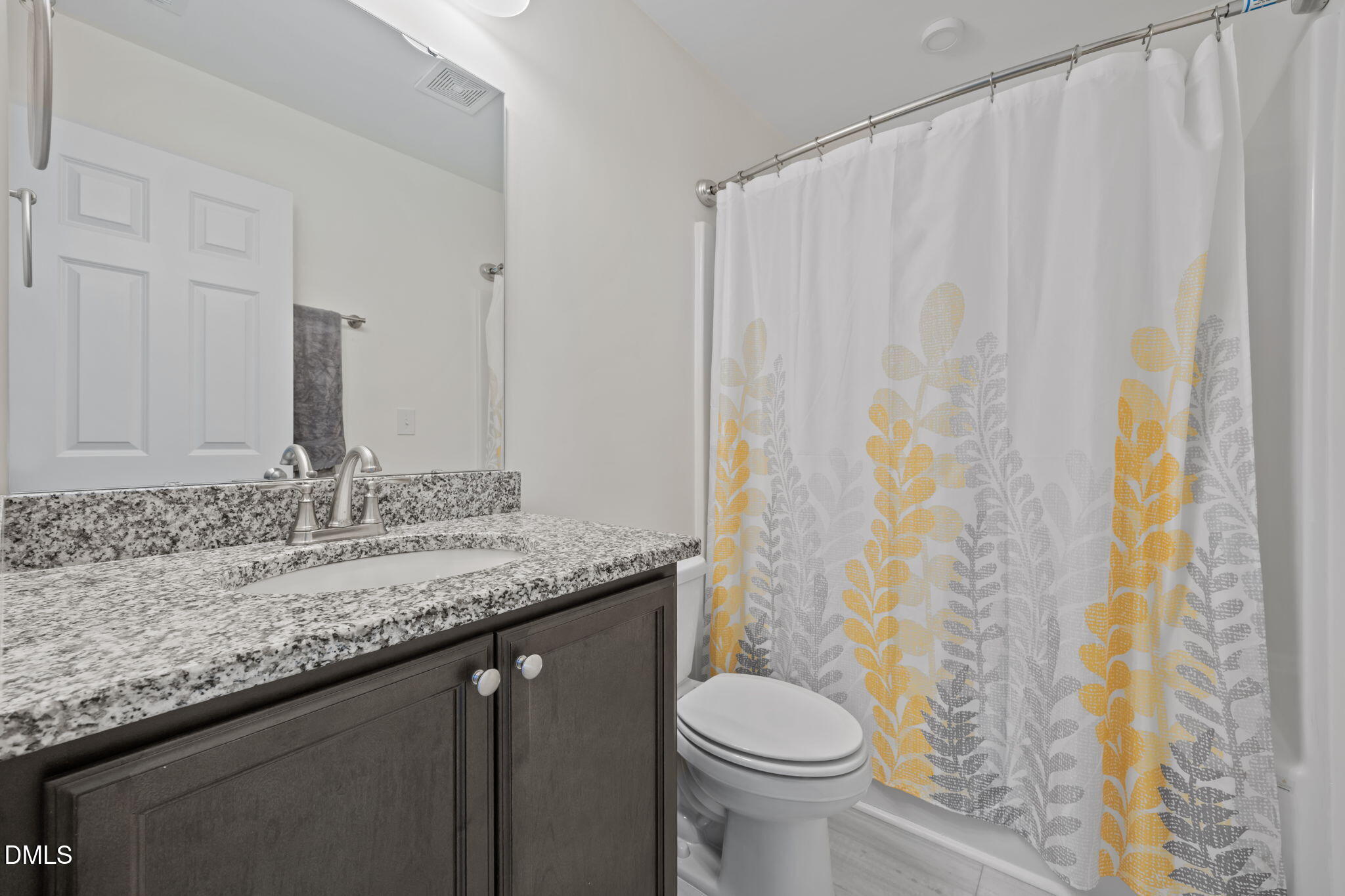 1049 Firetower Road Louisburg, NC 27549 - Photo 12 of 52 a bathroom with a granite countertop sink and a mirror
