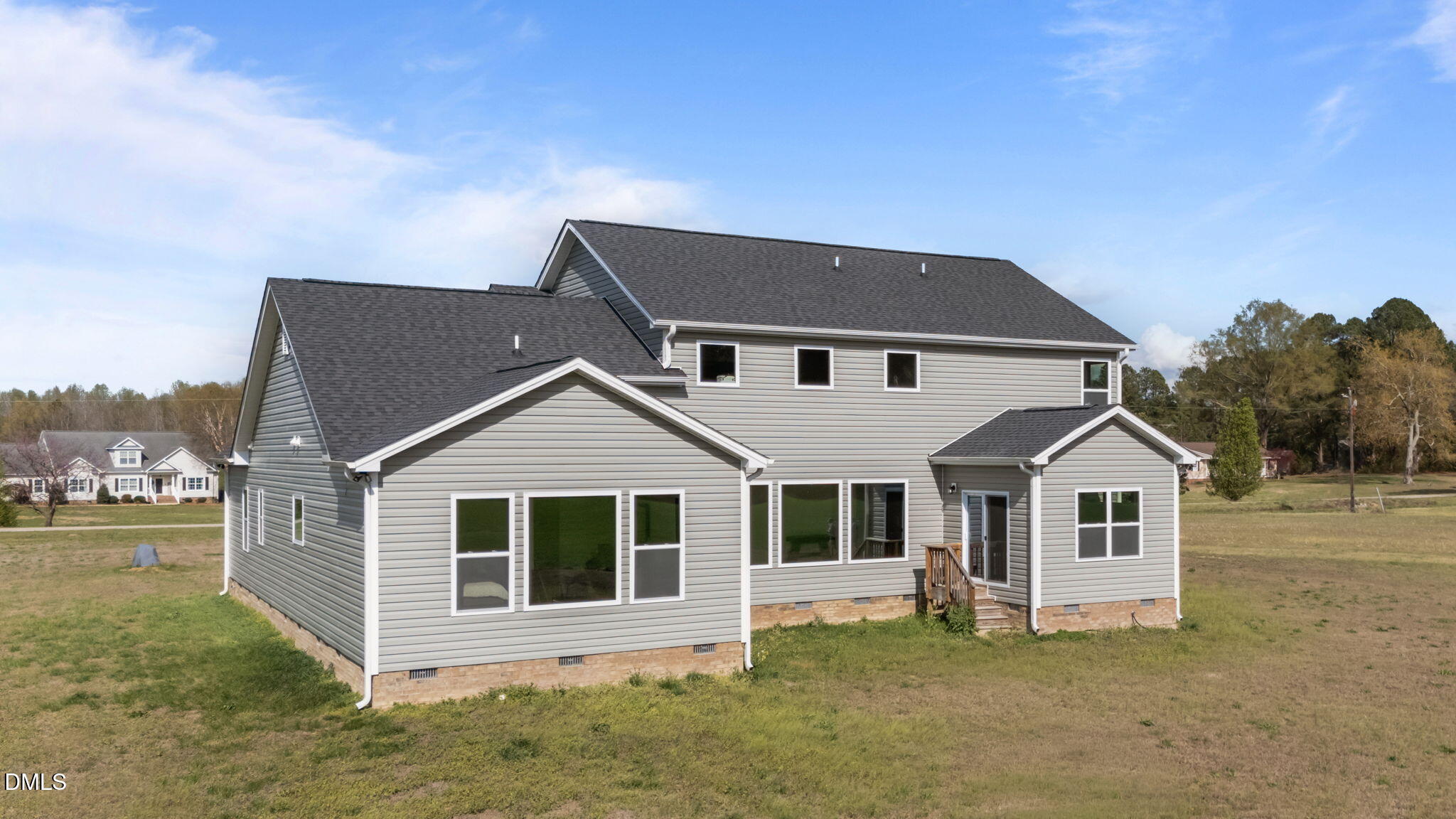 1049 Firetower Road Louisburg, NC 27549 - Photo 16 of 52 a front view of a house with a yard